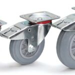 Roue pivotante à frein à bandage caoutchouc